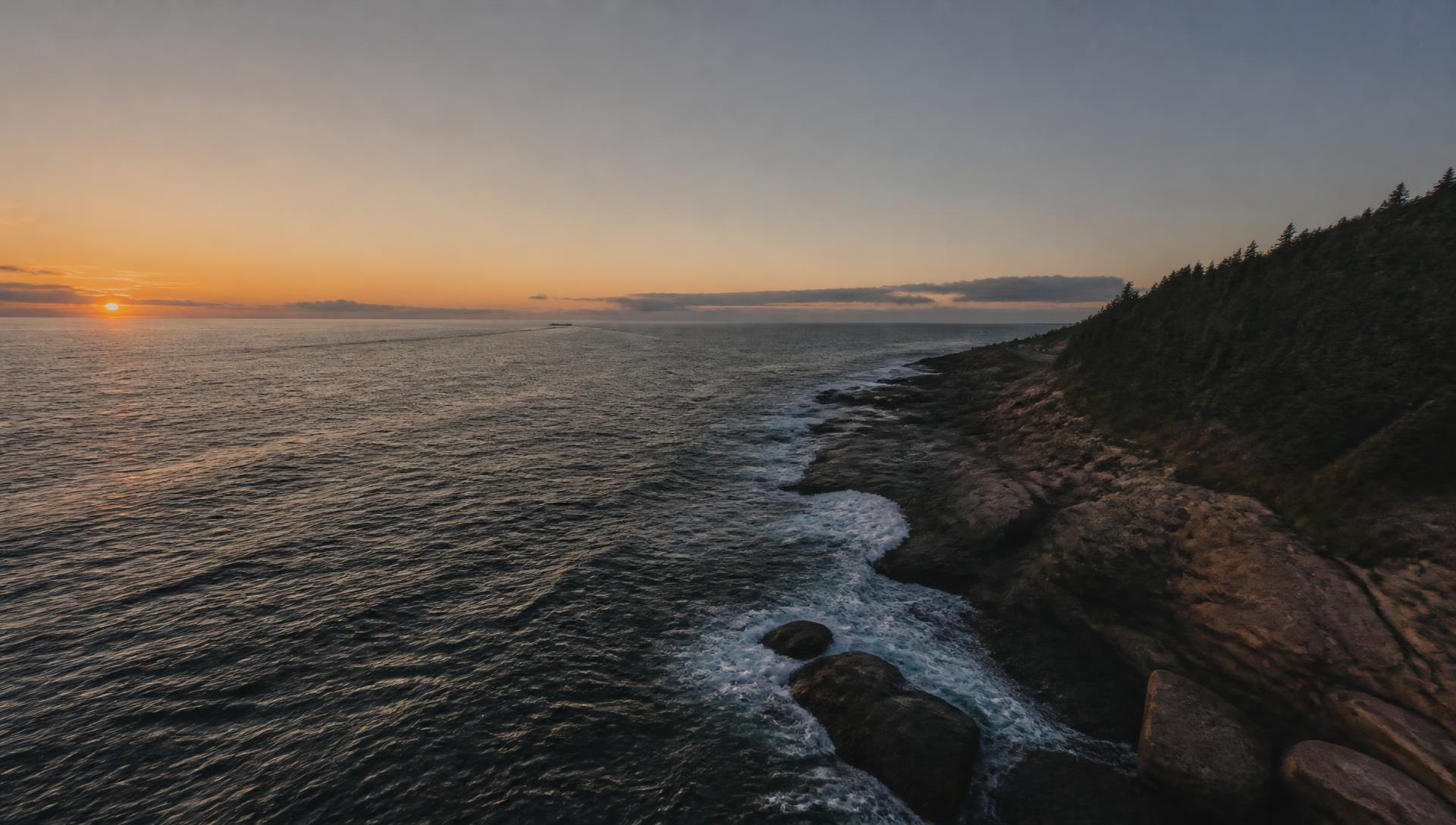 Aerial plate of a dark littoral coastline at dawn